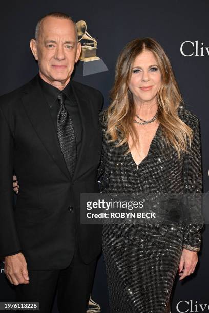 Actor Tom Hanks and his wife actress-singer Rita Wilson arrive for the Recording Academy and Clive Davis' Salute To Industry Icons pre-Grammy gala at...