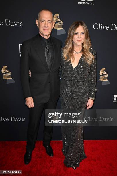 Actor Tom Hanks and his wife actress-singer Rita Wilson arrive for the Recording Academy and Clive Davis' Salute To Industry Icons pre-Grammy gala at...