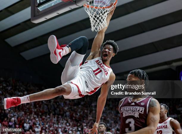 Mohamed Wague of the Alabama Crimson Tide throws down a second half slam dunk against the Mississippi State Bulldogs at Coleman Coliseum on February...