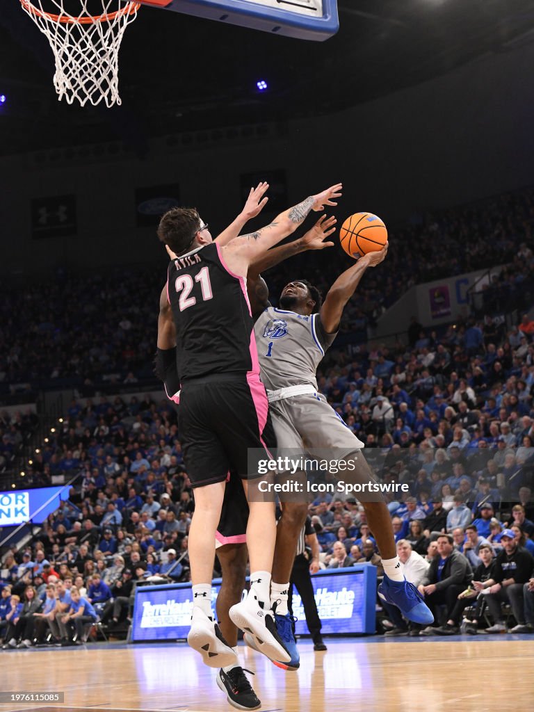 Jason Drake Indiana Drake Bulldogs Guard Kevin Overton attempts a goal against Indiana ...