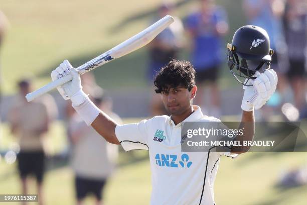 New Zealand's Rachin Ravindra celebrates reaching his century during day one of the first cricket Test match between New Zealand and South Africa at...