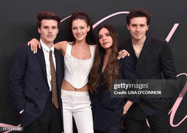 Former British model Brooklyn Beckham, British fashion designer and singer Victoria Beckham, US actress Nicola Peltz Beckham and British singer Cruz...