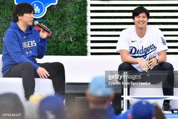Los Angeles Dodgers designated hitter Shohei Ohtani and his interpreter Ippei Mizuhara looks on during DodgerFest at Dodger Stadium on February 03,...