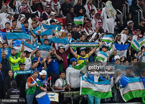 Fans from Uzbekistan are cheering during the AFC Asian Cup 2023 Quarter-Final match between Qatar and Uzbekistan at Al Bayt Stadium in Al Khor,...