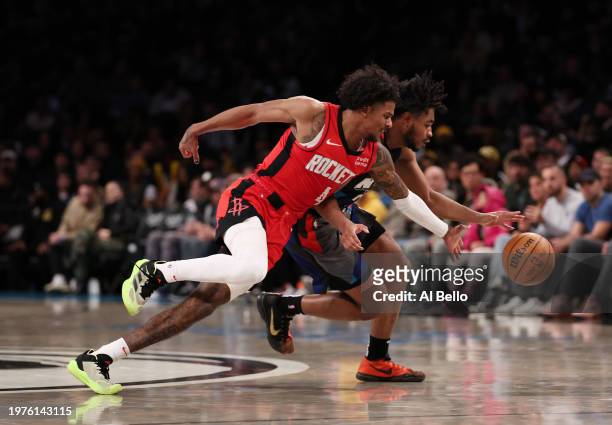 Jalen Green of the Houston Rockets and Cam Thomas of the Brooklyn Nets battle for the ball during their game at Barclays Center on January 27, 2024...