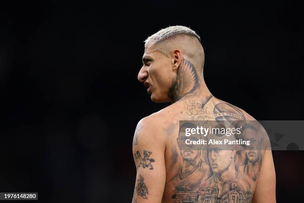 Tattoo with the faces of Ronaldo, Richarlison and Neymar Jr. Is seen on the back of Richarlison of Tottenham Hotspur as he leaves the pitch after the...