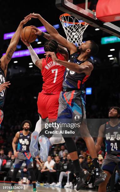 Cam Whitmore of the Houston Rockets shoots against Mikal Bridges of the Brooklyn Nets during their game at Barclays Center on January 27, 2024 in New...