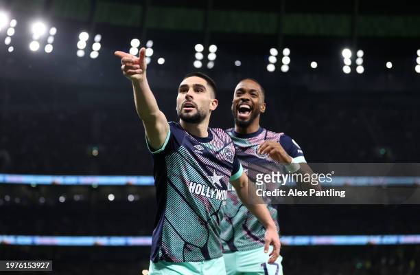 Neal Maupay of Brentford celebrates scoring his team's first goal with team mate Ivan Toney during the Premier League match between Tottenham Hotspur...