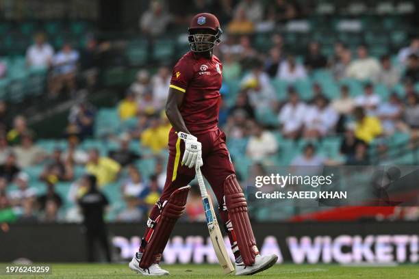 West Indies' batsman Justin Greaves walks off the fields after his dismissal during the second one-day international cricket match between Australia...