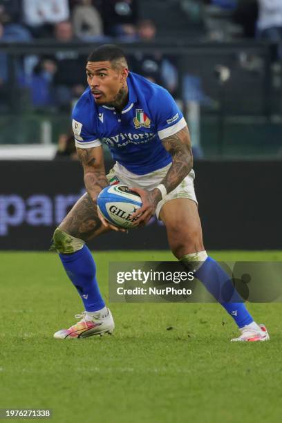 Monty Ioane of Italy is in action during the first match of the Guinness Six Nations tournament between Italy and England at the Stadio Olimpico in...