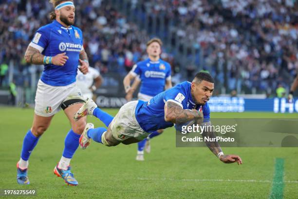 Monty Ioane of Italy is scoring a try during the first match of the Guinness Six Nations tournament between Italy and England at the Stadio Olimpico...