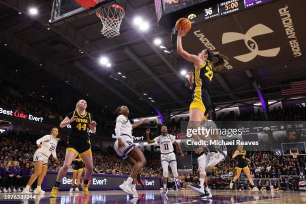 Caitlin Clark of the Iowa Hawkeyes scores her 3,403 career point, passing Kelsey Mitchell for second in Division I NCAA women's basketball history,...