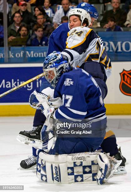 Trevor Kidd of the Toronto Maple Leafs skates against Scott Walker of the Nashville Predators during NHL game action on January 6, 2004 at Air Canada...