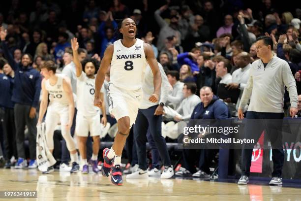 Quincy Olivari of the Xavier Musketeers celebrates a shot in the second half during a college basketball game against the St. John's Red Storm at the...