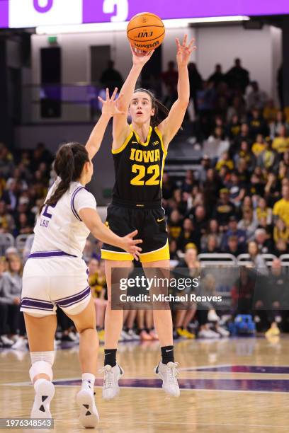 Caitlin Clark of the Iowa Hawkeyes shoots a three pointer against the Northwestern Wildcats during the first half at Welsh-Ryan Arena on January 31,...