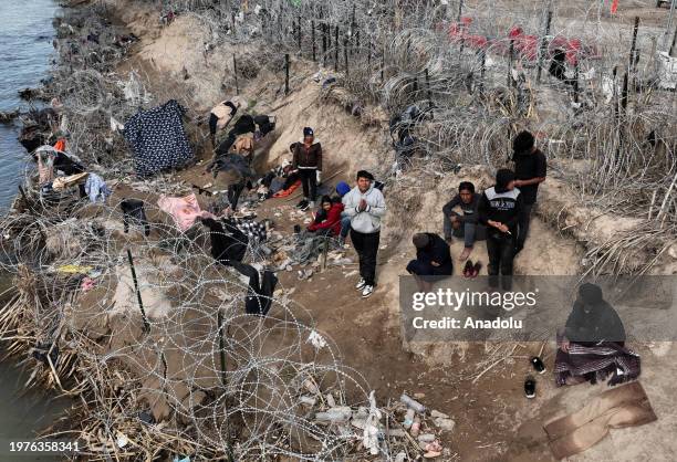 An aerial view shows an immigrant group trying to cross the Texan border despite heightened security measures in Eagle Pass, Texas on February 03,...