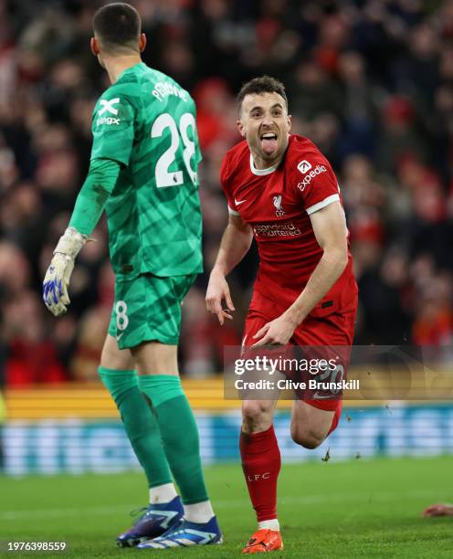 Diogo Jota of Liverpool celebrates scoring his team's first goal during the Premier League match between Liverpool FC and Chelsea FC at Anfield on...