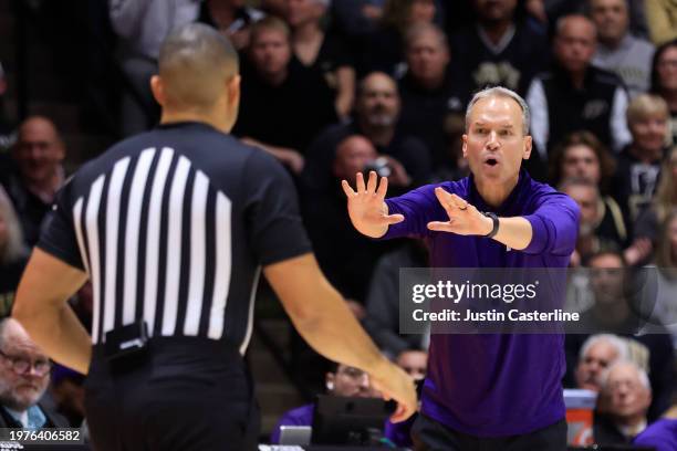 Head coach Chris Collins of the Northwestern Wildcats reacts after a play during the second half against the Purdue Boilermakers at Mackey Arena on...