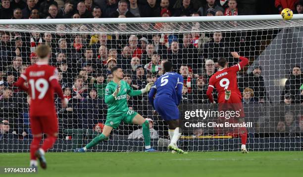 Darwin Nunez of Liverpool heads the ball at goal only to hit the crossbar during the Premier League match between Liverpool FC and Chelsea FC at...