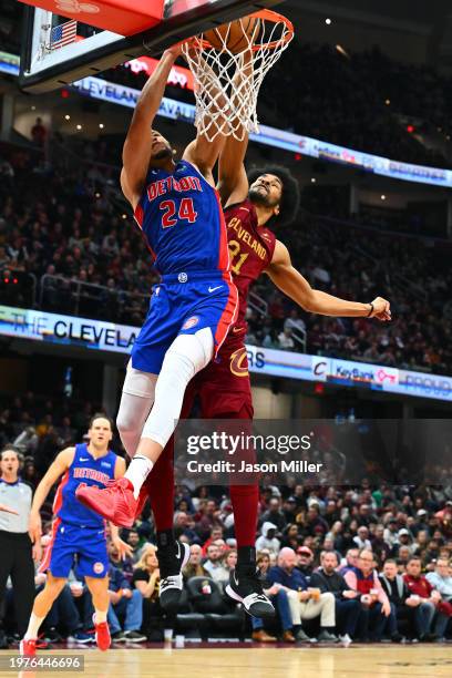 Kevin Knox II of the Detroit Pistons dunks over Jarrett Allen of the Cleveland Cavaliers during the third quarter at Rocket Mortgage Fieldhouse on...