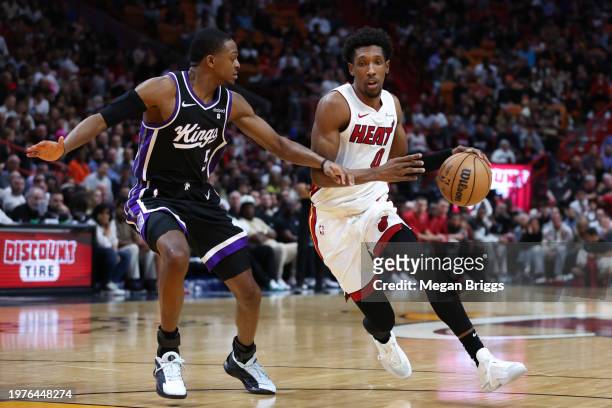 Josh Richardson of the Miami Heat drives against De'Aaron Fox of the Sacramento Kings during the third quarter of the game at Kaseya Center on...