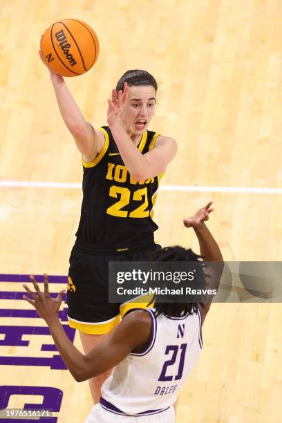 Caitlin Clark of the Iowa Hawkeyes passes around Melannie Daley of the Northwestern Wildcats during the second half at Welsh-Ryan Arena on January...