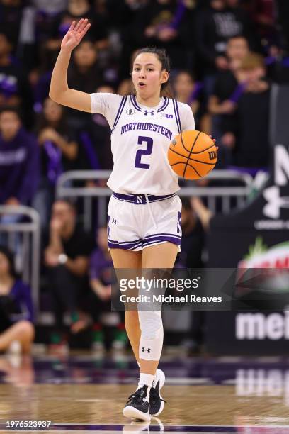 Caroline Lau of the Northwestern Wildcats dribbles up the court against the Iowa Hawkeyes during the second half at Welsh-Ryan Arena on January 31,...