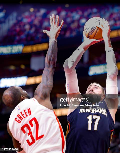 Jonas Valanciunas of the New Orleans Pelicans shoots over Jeff Green of the Houston Rockets during the second half at Toyota Center on January 31,...