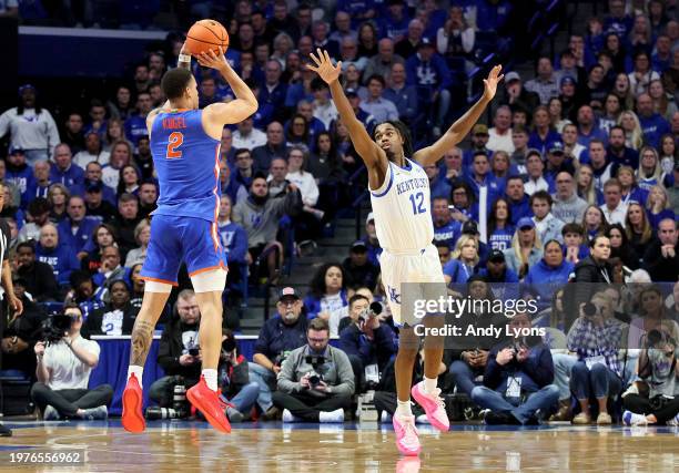 Riley Kugel of the Florida Gators shoots the ball in the second half while defended by Reed Sheppard of the Kentucky Wildcats at Rupp Arena on...