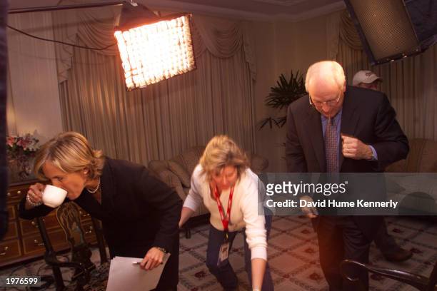 Today Show anchor Katie Couric grabs a cup of coffee after interviewing Vice;Presidential candidate Dick Cheney at the Hay Adams Hotel November 28,...