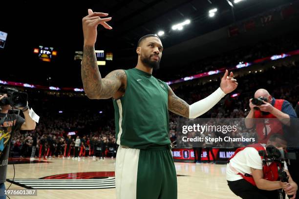 Damian Lillard of the Milwaukee Bucks acknowledges the crowd during his return against the Portland Trail Blazers at Moda Center on January 31, 2024...