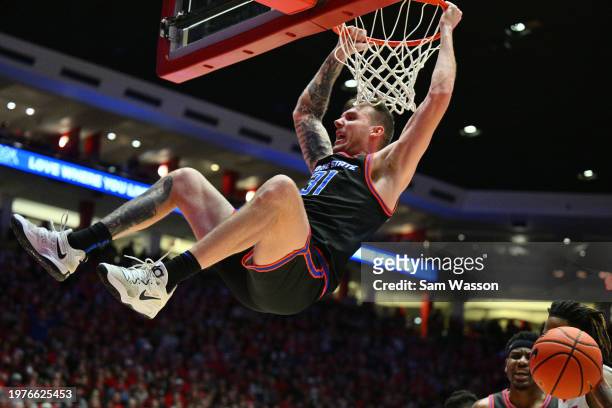 Cam Martin of the Boise State Broncos dunks against the New Mexico Lobos during the first half at The Pit on January 31, 2024 in Albuquerque, New...