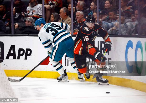 Ryan Strome of the Anaheim Ducks skates the puck against Logan Couture of the San Jose Sharks in the second period at Honda Center on January 31,...