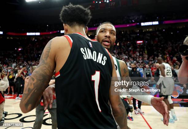 Damian Lillard of the Milwaukee Bucks greets Anfernee Simons of the Portland Trail Blazers after the Portland Trail Blazers beat the Milwaukee Bucks...