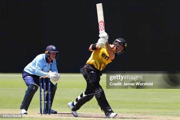 Arcy Short of Western Australia plays a shot down the ground for four runs during the Marsh One Day Cup match between Western Australia and New South...