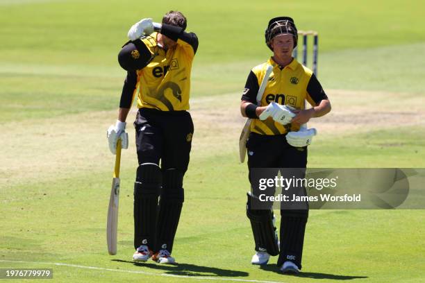 Andrew Tye of Western Australia and D'Arcy Short of Western Australia walk during a drinks break during the Marsh One Day Cup match between Western...