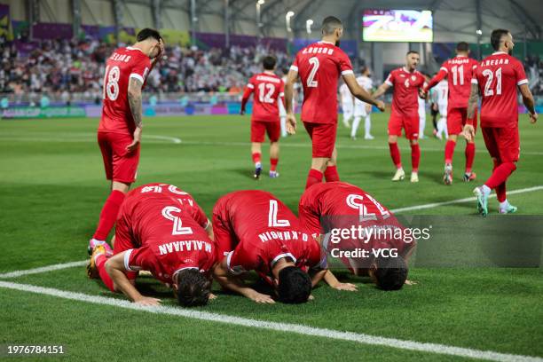 Players of Syria celebrate scoring a goal during the AFC Asian Cup Qatar 2023 Round of 16 match between Iran and Syria at Abdullah bin Khalifa...