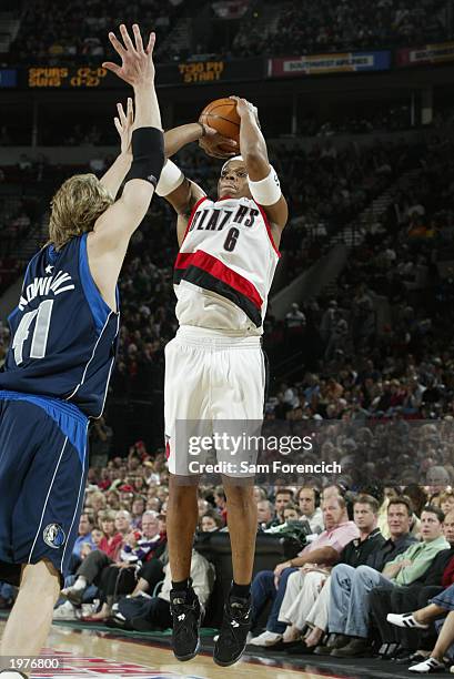 Bonzi Wells of the Portland Trail Blazers shoots over Dirk Nowitzki of the Dallas Mavericks in Game four of the Western Conference Quarterfinals...