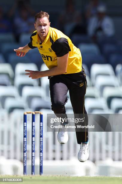 Jason Behrendorff of Western Australia follows through after his bowling during the Marsh One Day Cup match between Western Australia and New South...
