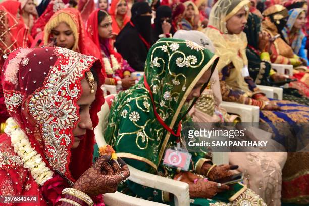 Muslim brides attend a mass marriage ceremony organised by Gujarat Sarvajanik Welfare trust in Ahmedabad on February 4 where around 130 couples tied...