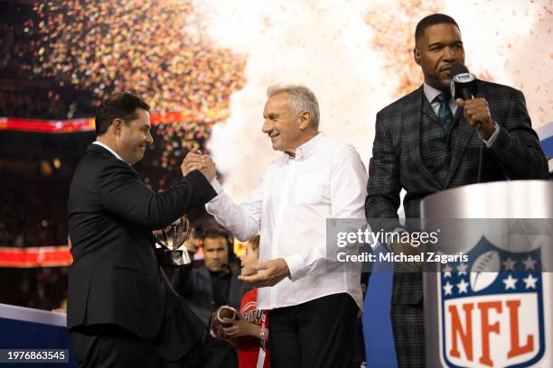 Fox Sports broadcaster Michael Strahan interviews CEO Jed York and alumnus Joe Montana of the San Francisco 49ers after the NFC Championship game...