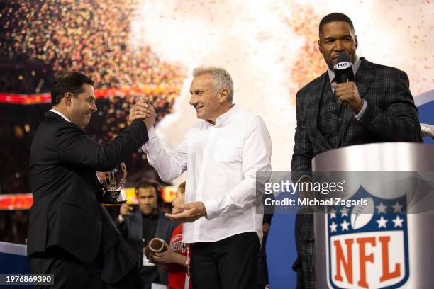 Fox Sports broadcaster Michael Strahan interviews CEO Jed York and alumnus Joe Montana of the San Francisco 49ers after the NFC Championship game...