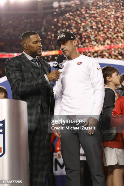 Fox Sports broadcaster Michael Strahan interviews Head Coach Kyle Shanahan of the San Francisco 49ers after the NFC Championship game against the...