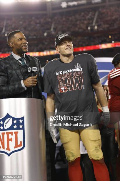 Fox Sports broadcaster Michael Strahan interviews Christian McCaffrey of the San Francisco 49ers after the NFC Championship game against the Detroit...