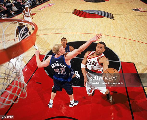 Damon Stoudamire of the Portland Trail Blazers takes the layup against Evan Eschmeyer of the Dallas Mavericks in Game Four of the Western Conference...