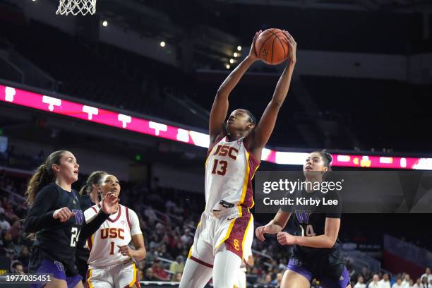 Southern California Trojans center Rayah Marshall rebounds the ball against Washington Huskies forward Dalayah Daniels and guard Elle Ladine during...