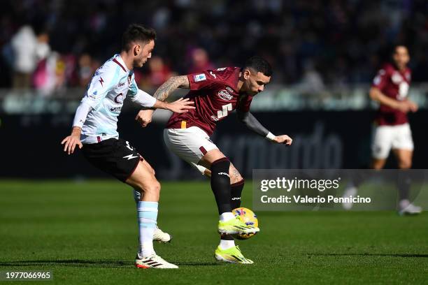 Antonio Sanabria of Torino FC is challenged by Giulio Maggiore of US Salernitana during the Serie A TIM match between Torino FC and US Salernitana at...