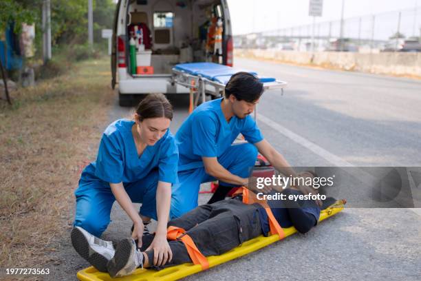 health care workers safe people from accident. - pessoal de ambulância imagens e fotografias de stock