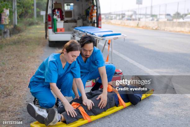 health care workers safe people from accident. - first aid class stock pictures, royalty-free photos & images