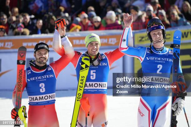 Loic Meillard of Team Switzerland takes 2nd place, Daniel Yule of Team Switzerland takes 1st place, Clement Noel of Team France takes 3rd place...